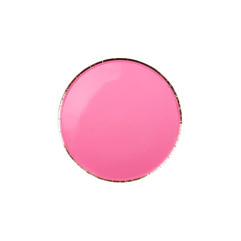 Pink round object with gold rim on a white background