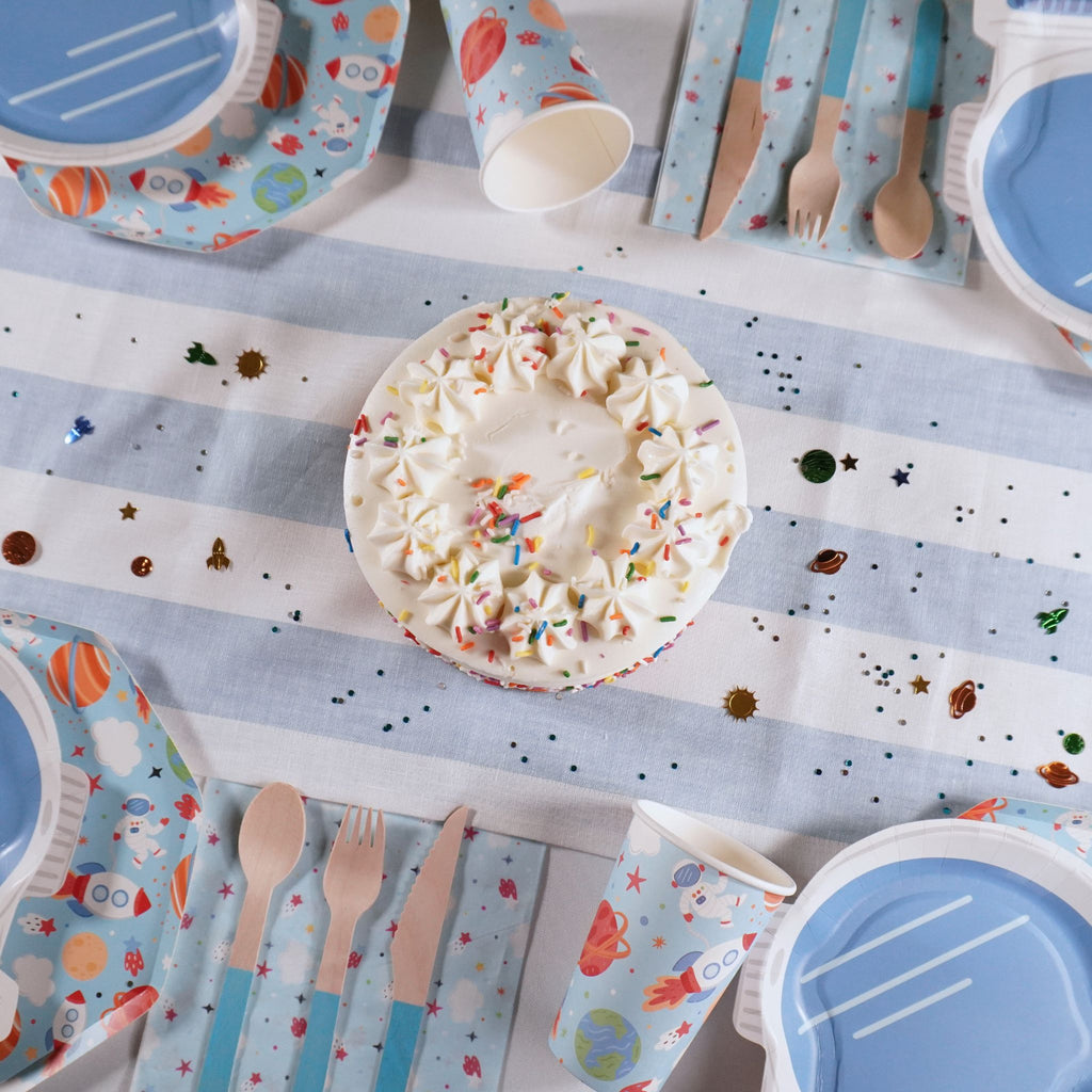 Space-themed birthday party pack with plates, cups, and banner by Festive Fun Co.