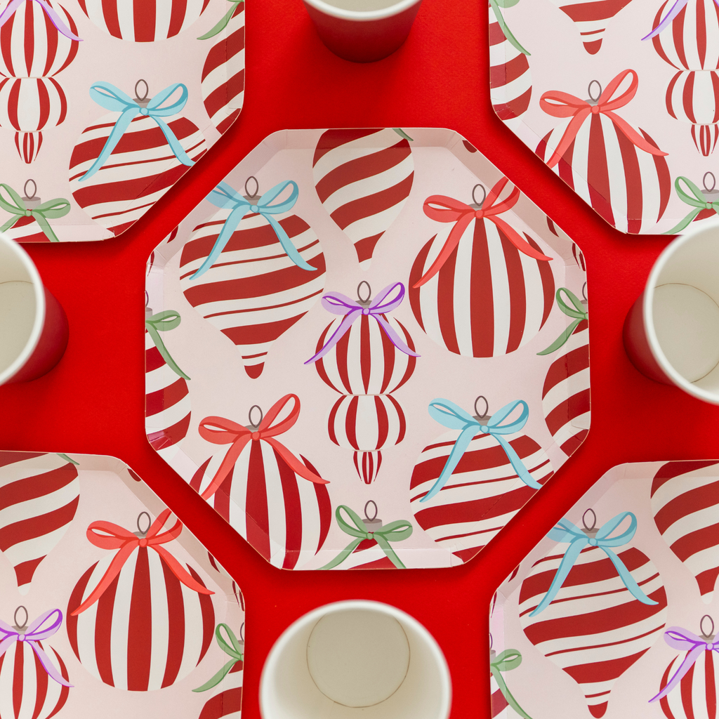 Holiday paper plates with ornament and bow design by Festive Fun Co.