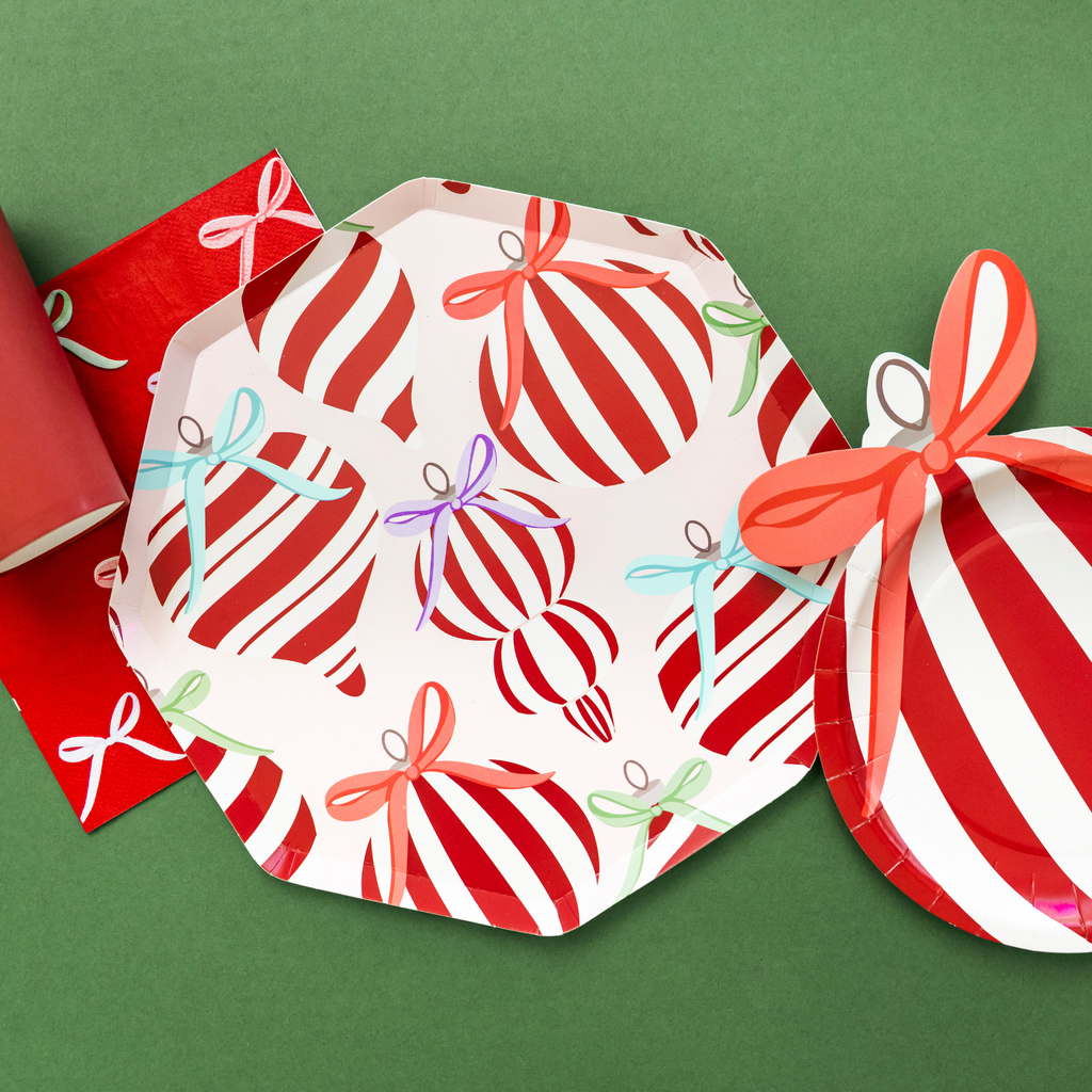 Holiday paper plates with ornament and bow design by Festive Fun Co.