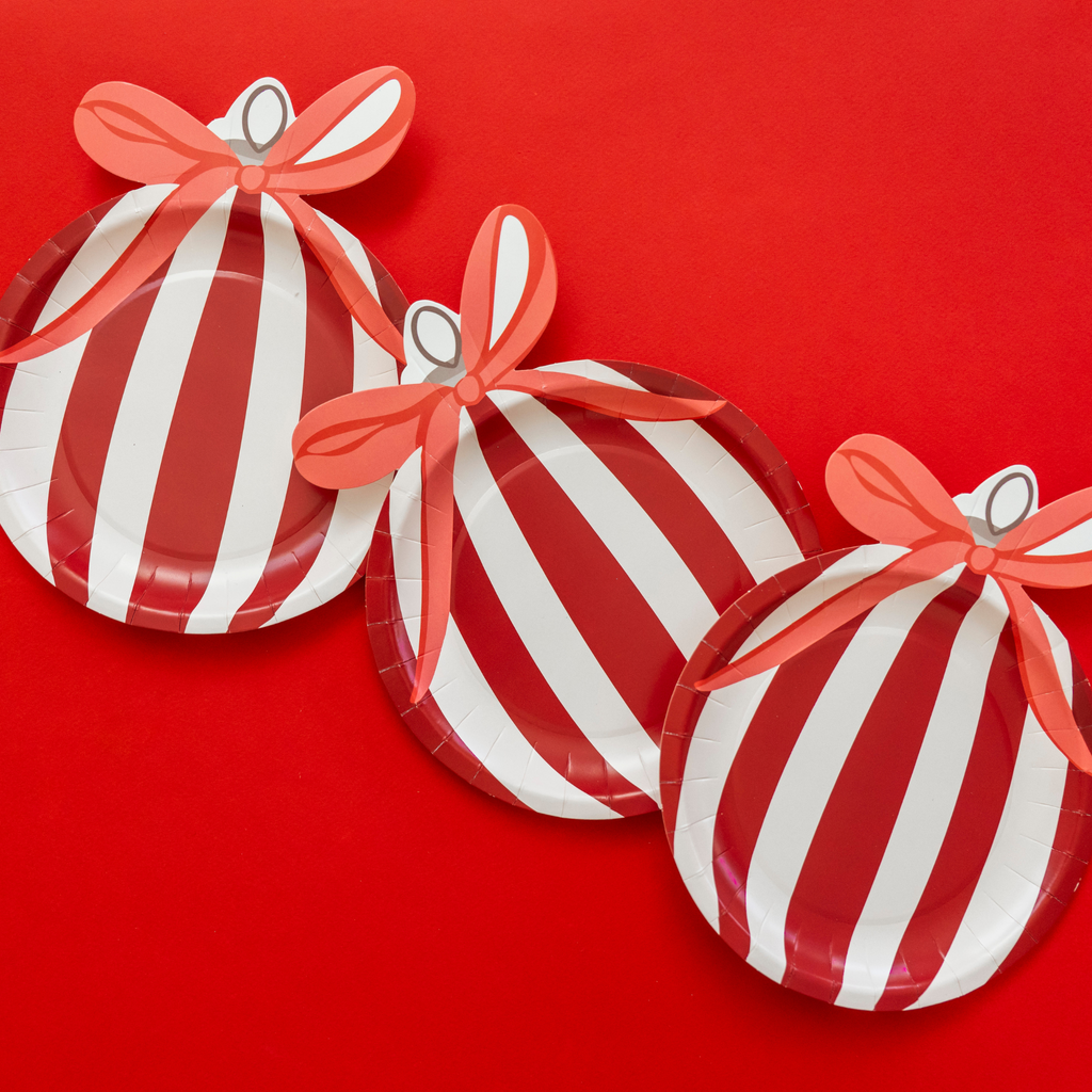 Red and white ornament-shaped Christmas paper plates by Festive Fun Co.