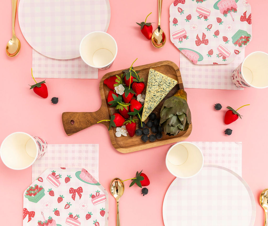 Strawberry-themed birthday party pack with pink gingham plates by Festive Fun Co.
