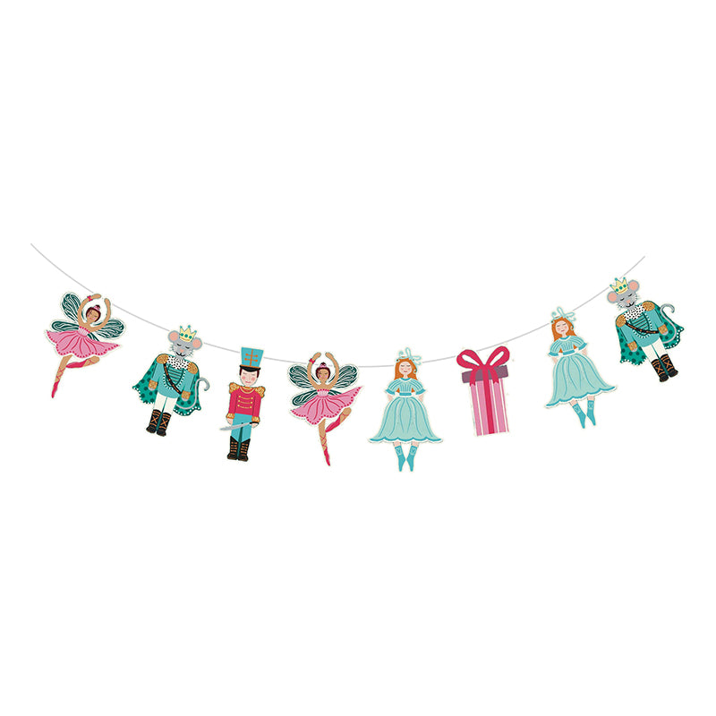Decorative string banner with fairy and nutcracker characters on a white background