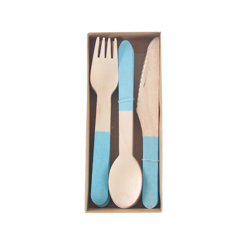Set of wooden cutlery with blue dipped handles in a box on a white background